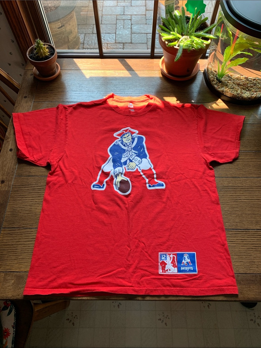 Tom Brady Football Tee with Patriots  logo on the front.